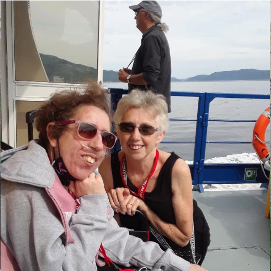 Mother and Daughter on cruise ship Daughter wearing nasal cannula