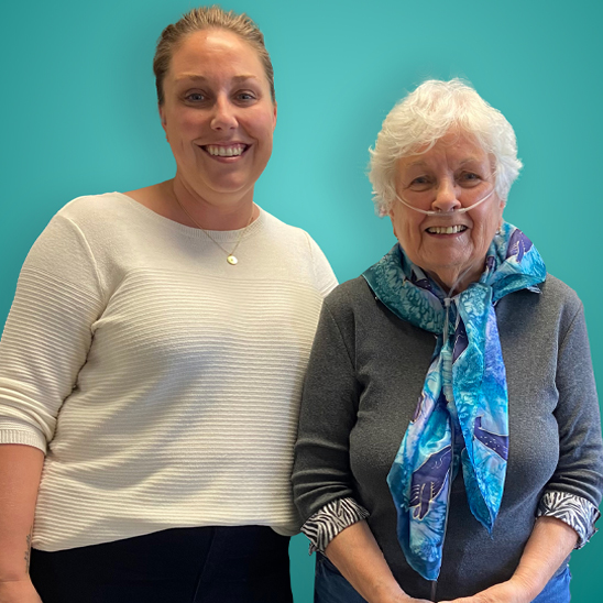 ProResp RT woman standing with Senior patient woman