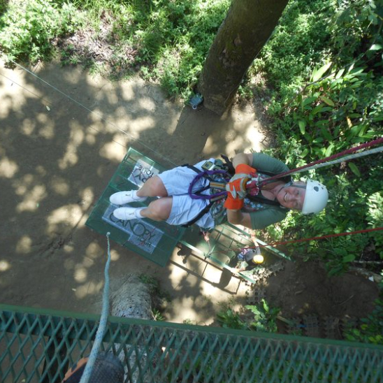 Senior woman ziplining