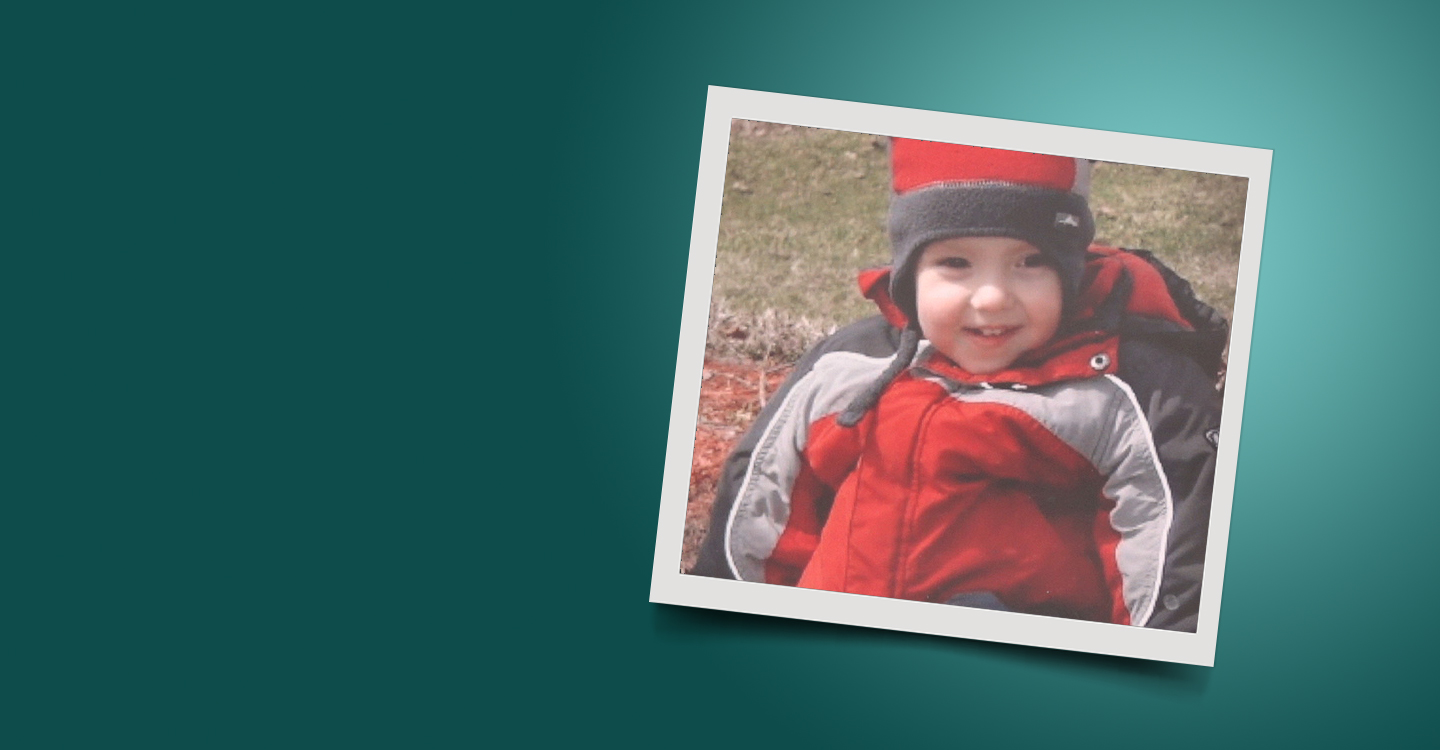 Photo of a boy in snowsuit