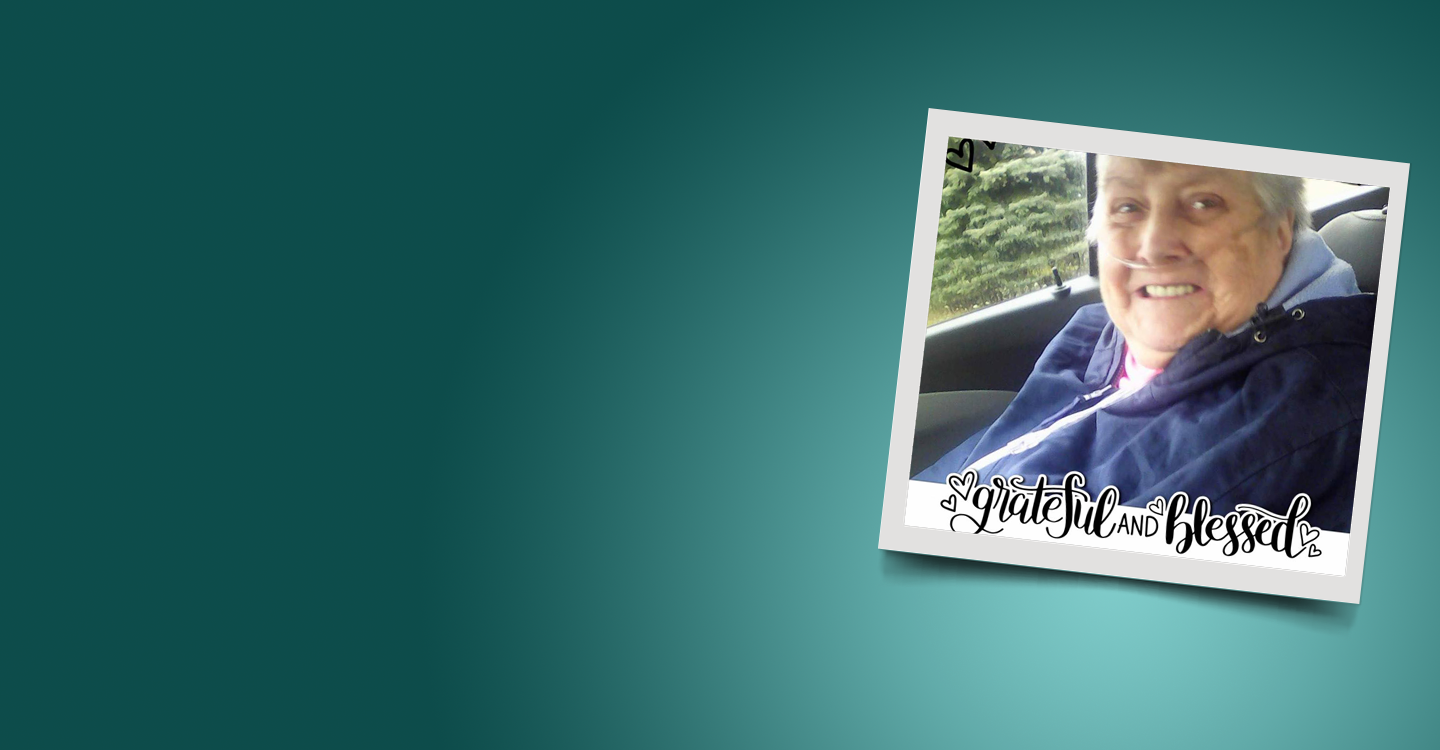 woman in car with text "Grateful and Blessed"