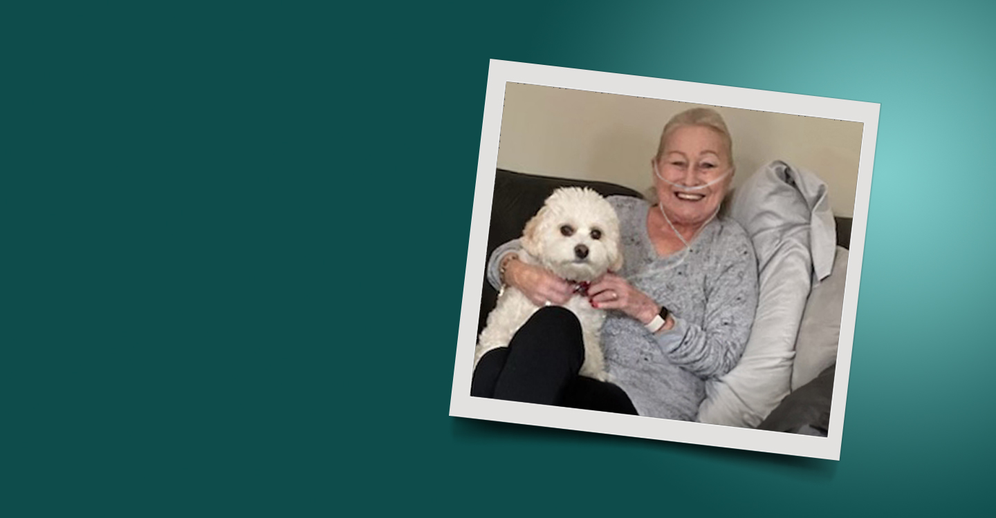 Photo of Nancy and her small white dog