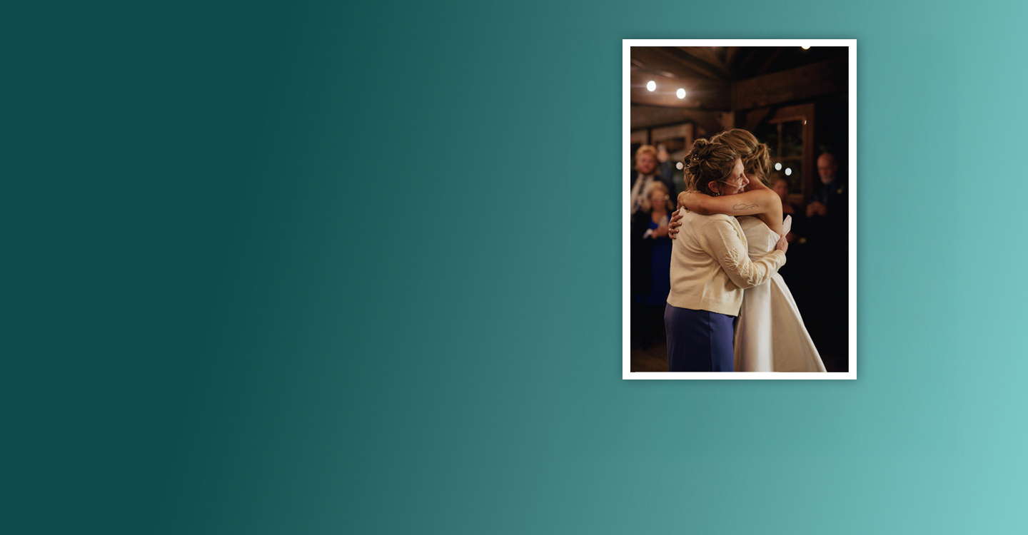 Angela hugging her daughter at her wedding