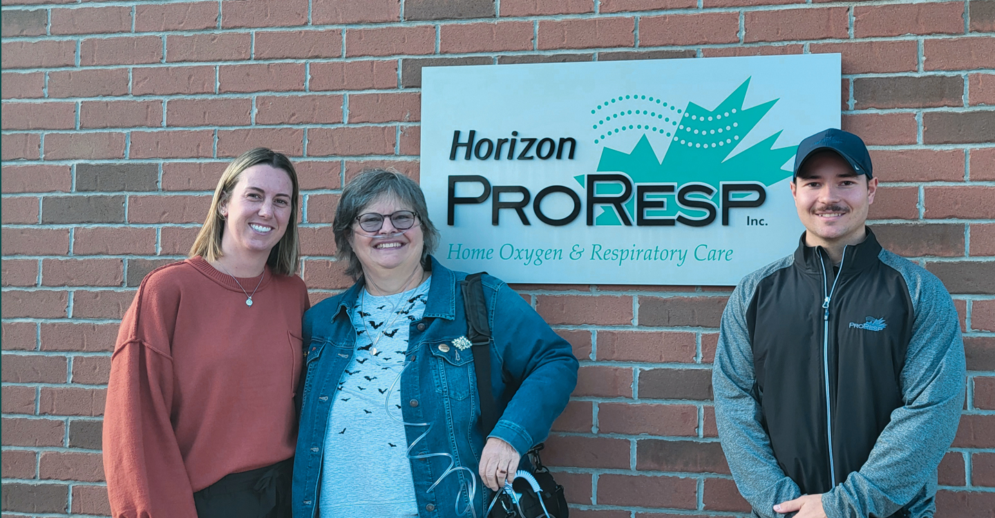 Elizabeth outside of a proresp office with ProResp employees