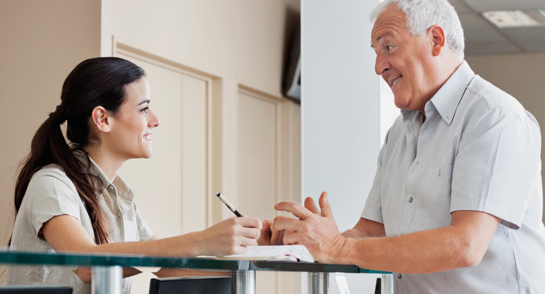 A customer service representative greets a customer.