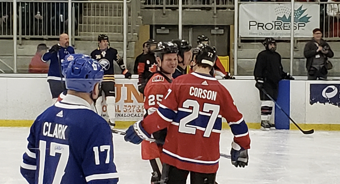 Hockey players in an ice hockey arena.