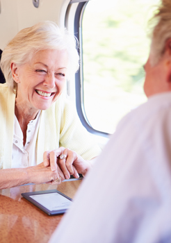 A couple sit on a train.